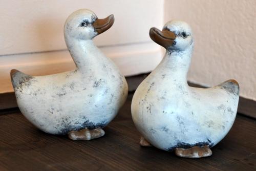 two rubber ducks sitting on top of a table at Haus Treffer in Kirchdorf in Tirol