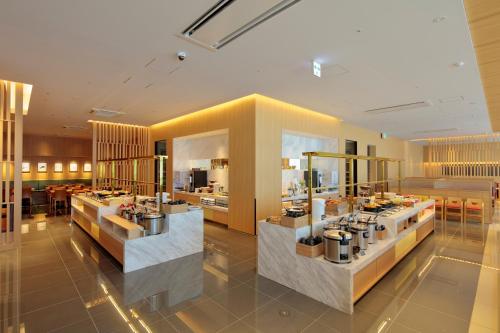 a store with several counters in a large room at THE SINGULARI HOTEL & SKYSPA at UNIVERSAL STUDIOS JAPAN in Osaka