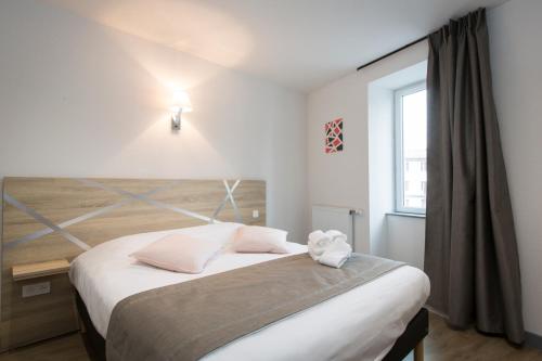 Ένα ή περισσότερα κρεβάτια σε δωμάτιο στο Le Relais Délys
