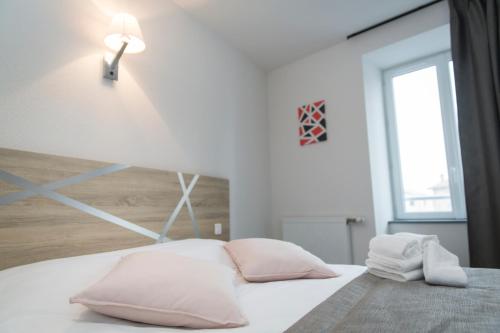 Ένα ή περισσότερα κρεβάτια σε δωμάτιο στο Le Relais Délys