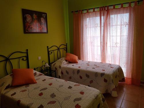 Postel nebo postele na pokoji v ubytování Casa Maria en Agaete