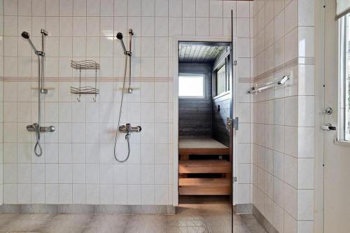 a bathroom with a shower and a walk in shower at Villa SUNSET in Malax