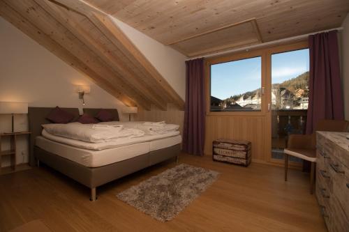 Postel nebo postele na pokoji v ubytování Chalet Belmont Penthouse