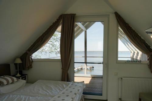 Postel nebo postele na pokoji v ubytování Strandhus17