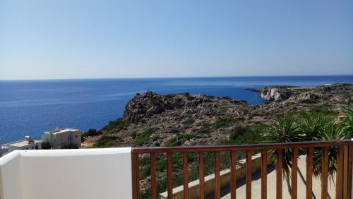 a balcony with a view of the ocean at Olympos Studios in Amoopi