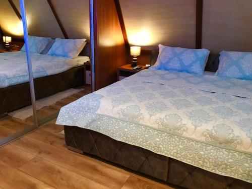 Postel nebo postele na pokoji v ubytování Vip Apartments Kopaonik