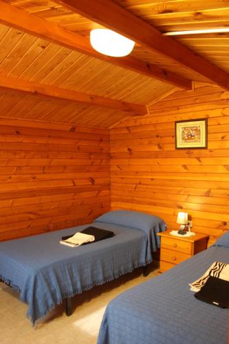 Postel nebo postele na pokoji v ubytování Camping & Bungalows Oasis