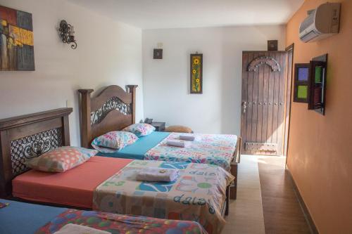 En eller flere senge i et værelse på Posada El Abuelo