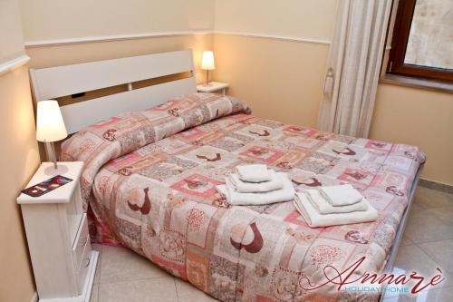 מיטה או מיטות בחדר ב-Annarè Home Holiday