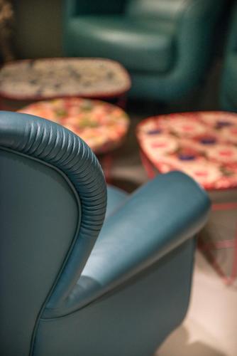 a close up of a chair and two pizzas at Point Hotel in Piove di Sacco