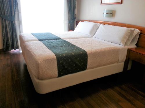 Hotel Alameda Málagaにあるベッド