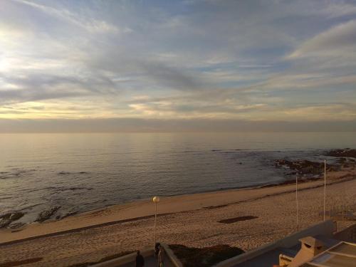 a view of the ocean from the balcony of a beach at Largo do cruzeiro in Póvoa de Varzim