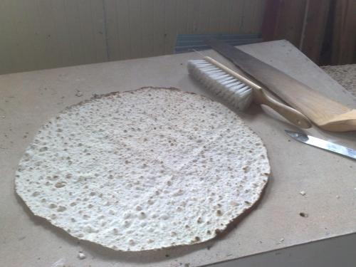 a tortilla sitting on top of a counter next to a knife at Christinagården Guesthouse in Ramsele