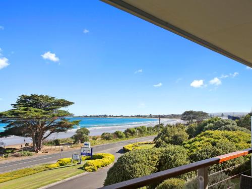 a view of the beach from the balcony of a house at BIG4 Apollo Bay Pisces Holiday Park in Apollo Bay