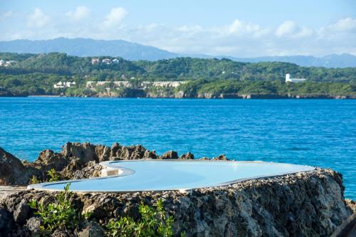 a small island in the middle of a body of water at Casa Marina Beach & Reef All Inclusive in Sosúa