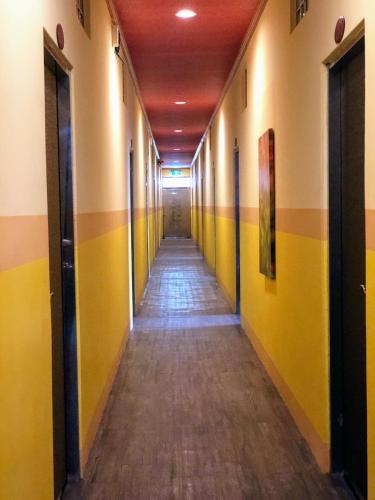 a hallway in an office building with yellow walls at 吾居吾宿 in Zhixue