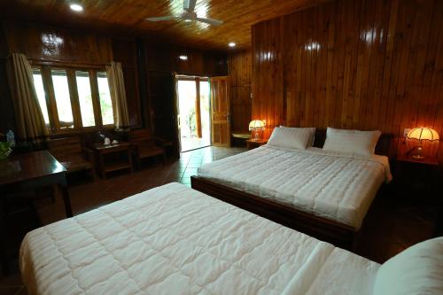 Кровать или кровати в номере Boutique Lodge Can Tho Homestay
