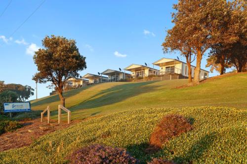 a row of houses on top of a hill at BIG4 Apollo Bay Pisces Holiday Park in Apollo Bay