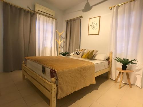 a bedroom with a bed in a room at beNordic -8-10mins Tambun Water Park-10-14Pax in Ipoh