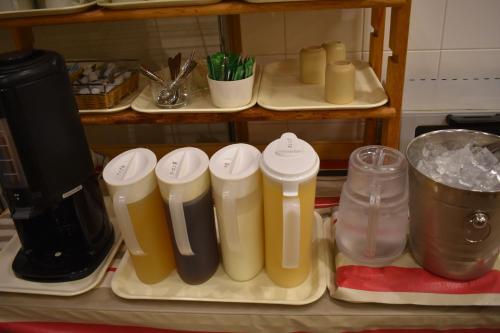a kitchen counter with a bunch of different appliances at Hotel Crown Hills Toyokawa in Toyokawa