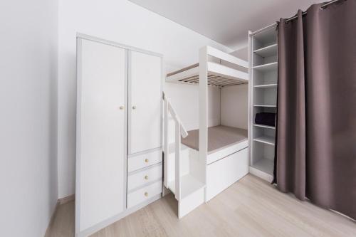 מיטה או מיטות בחדר ב-Sandra apartamentai