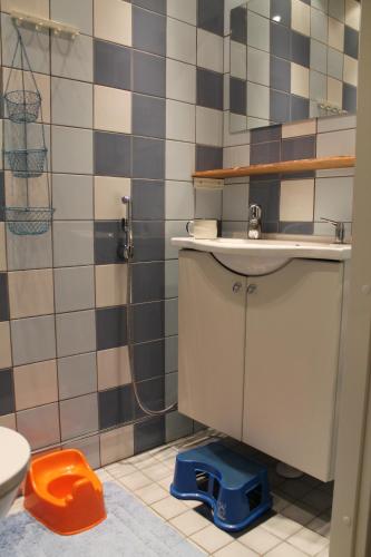 a bathroom with a sink and a shower at Oak House in Naantali