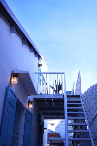 a person standing on top of a staircase on a building at Samstay in Tuy Hoa