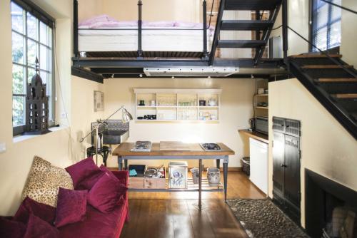 a living room with a couch and a table at Das Trafohaus in Solingen