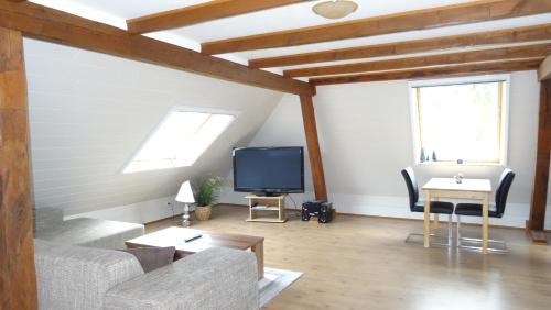 Televisyen dan/atau pusat hiburan di Gästezimmer & Appartement Elskop