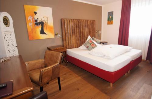 Ein Bett oder Betten in einem Zimmer der Unterkunft UNO Hotel Chapeau Noir