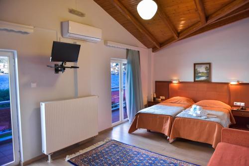 Postel nebo postele na pokoji v ubytování Oscar Hotel