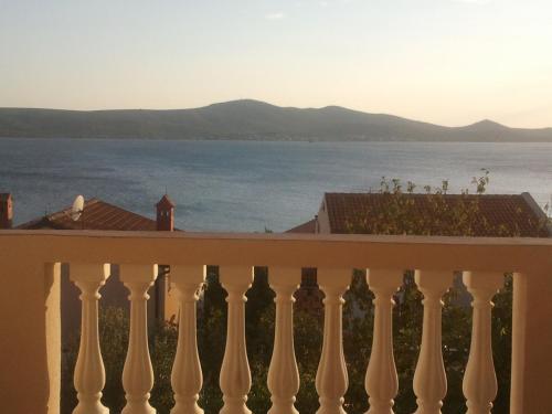 a view of the water from the balcony of a house at Apartments Brčić in Sveti Petar