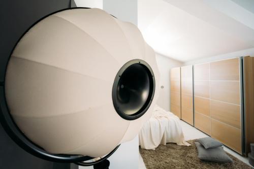 a bedroom with a large round mirror on the wall at Boutique Hotel Valsabbion in Pula