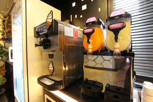 a microwave oven with a group of ski equipment at Hera Hotel in Daegu