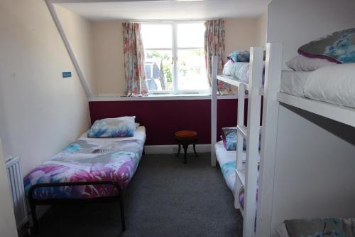Ένα ή περισσότερα κρεβάτια σε δωμάτιο στο Pitlochry Backpackers