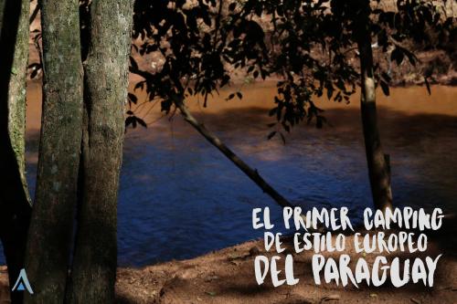 a sign that reads el primer camino de iguanaol paraguay at El Paraje Camping in Piribebuy
