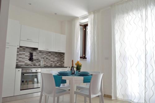 Η κουζίνα ή μικρή κουζίνα στο Largo Cannizzaro Apartments
