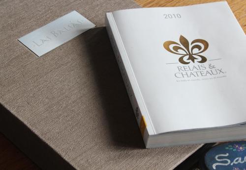 a book sitting on top of a table at Las Balsas Relais & Chateaux in Villa La Angostura