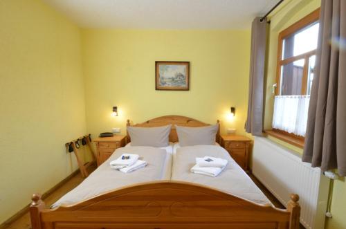 En eller flere senge i et værelse på Hotel Köhlerhütte