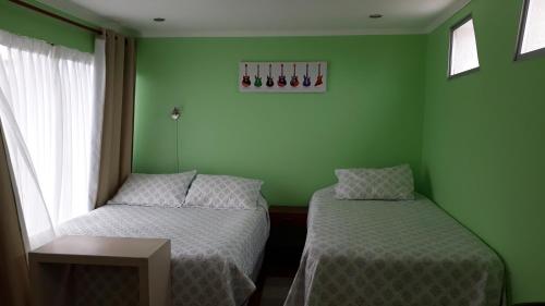 Postel nebo postele na pokoji v ubytování Apart Hotel Colors