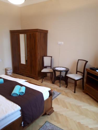 Ένα ή περισσότερα κρεβάτια σε δωμάτιο στο Csanabella House