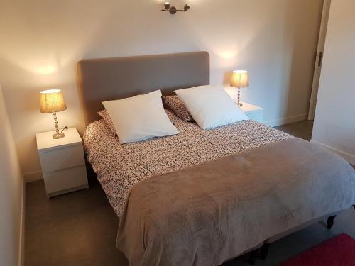 מיטה או מיטות בחדר ב-Le lodge