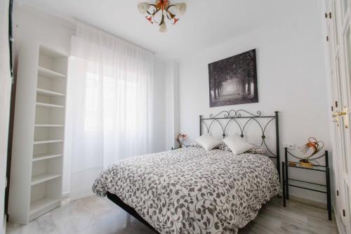 Posteľ alebo postele v izbe v ubytovaní Apartamentos Las Huertas