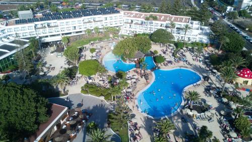 an aerial view of a resort with a pool at H10 Lanzarote Princess in Playa Blanca