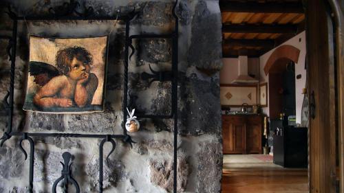a painting of a child on a stone wall at Hye Aspet Հայ Ասպետ in Gyumri