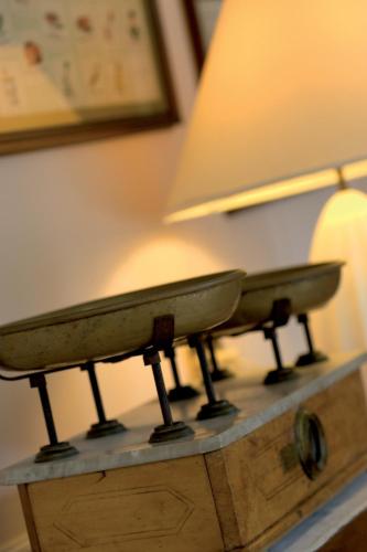 a table with a lamp and a surfboard on it at Regina Adelaide Hotel & SPA in Garda