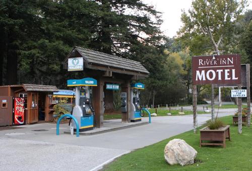 a model gas station in a park with a sign at Big Sur River Inn in Big Sur