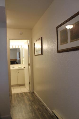 an empty room with a kitchen and a hallway at Big Pines Mountain House in South Lake Tahoe