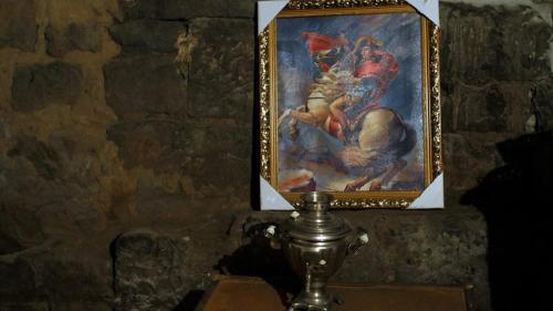 a picture of a painting on a wall at Hye Aspet Հայ Ասպետ in Gyumri