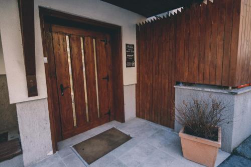 an entrance to a house with a wooden door at Hotel Nova Bentbaša in Sarajevo